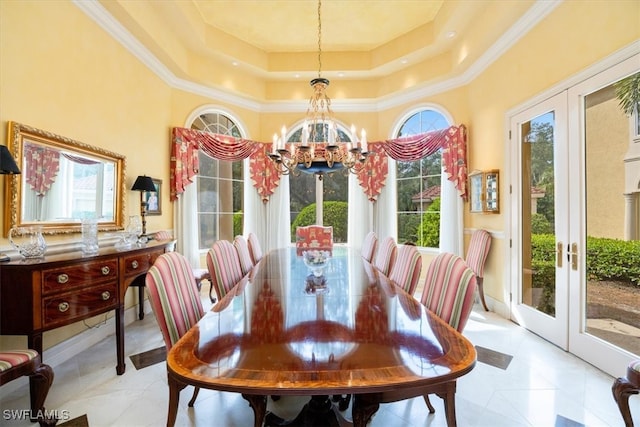 tiled dining space featuring french doors, crown molding, and a healthy amount of sunlight