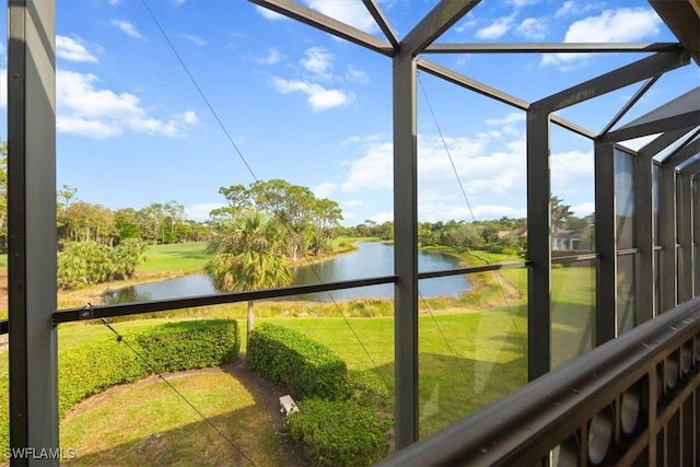 sunroom / solarium with a water view