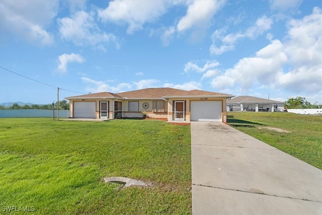 view of front of home featuring a garage and a front lawn