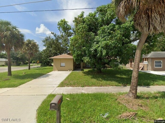 view of front of property with a front lawn