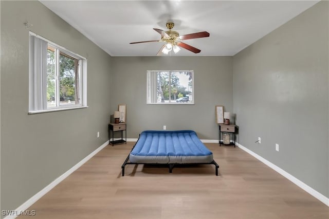 bedroom featuring ceiling fan and light hardwood / wood-style floors