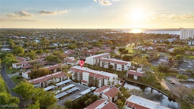 aerial view at dusk with a water view