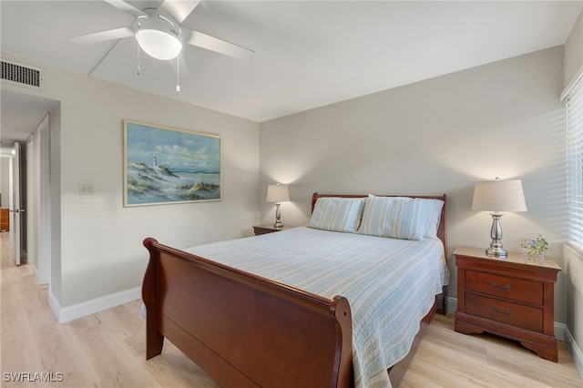 bedroom with light hardwood / wood-style floors and ceiling fan