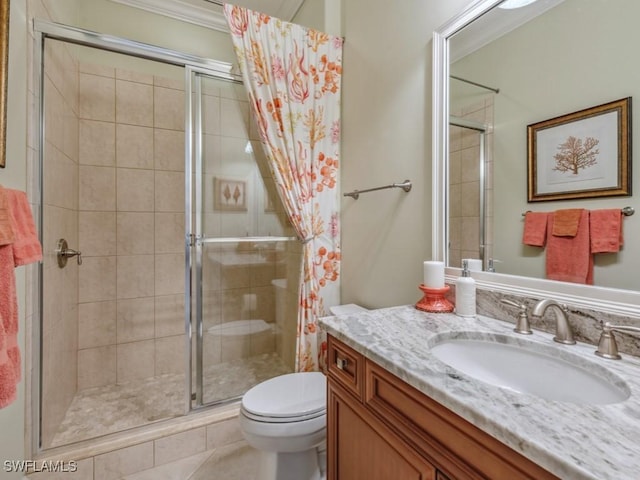 bathroom featuring tile patterned floors, vanity, toilet, walk in shower, and ornamental molding