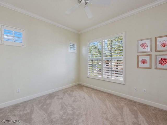 spare room featuring light carpet, ceiling fan, and ornamental molding