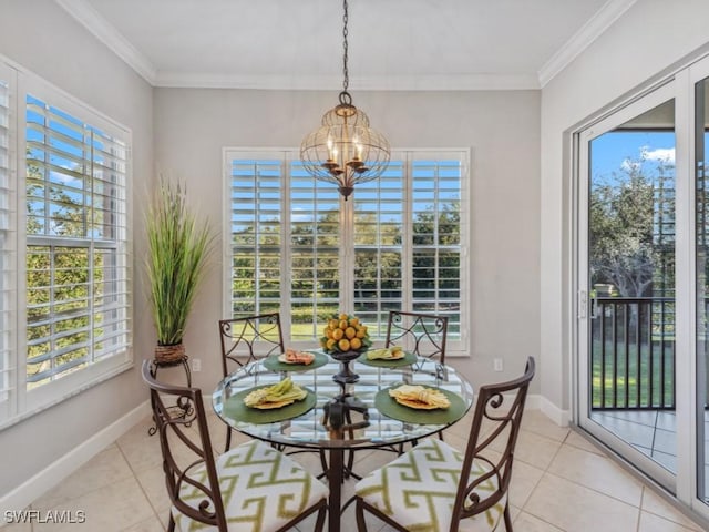 dining space featuring light tile patterned floors, ornamental molding, and an inviting chandelier