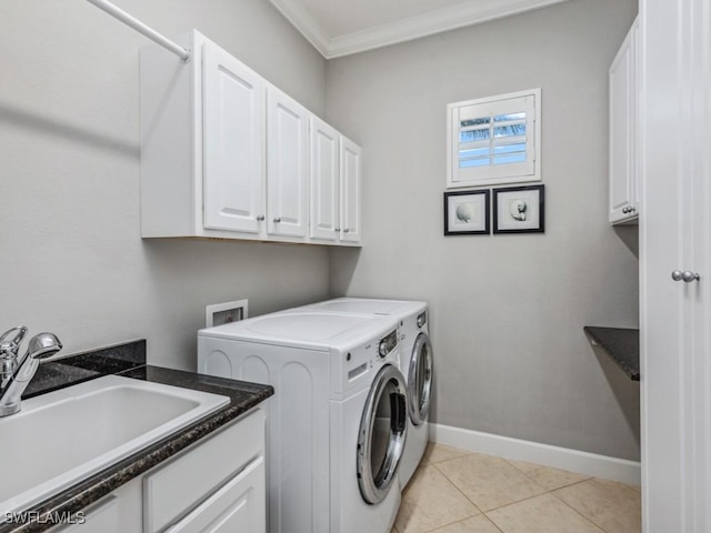 washroom with sink, washer and clothes dryer, ornamental molding, light tile patterned floors, and cabinets