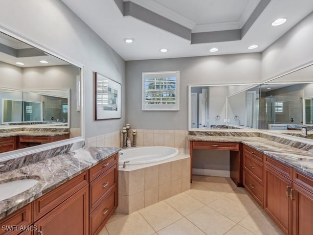 bathroom with a tray ceiling, plus walk in shower, tile patterned flooring, crown molding, and vanity