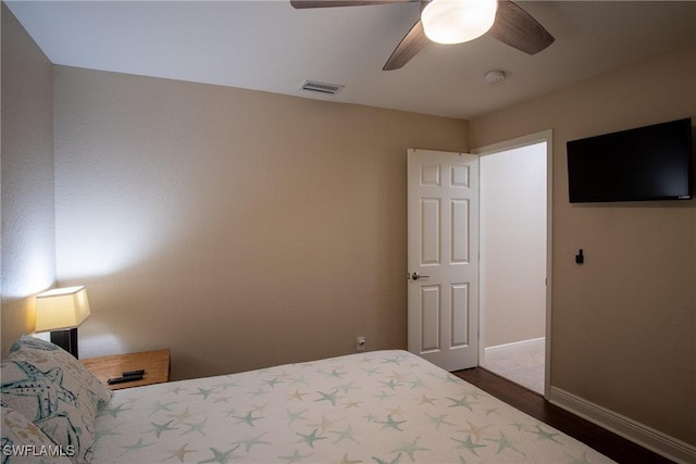 2902 SW 10th Pl, Cape Coral, FL 33914 - bedroom with dark wood finished floors, baseboards, and a ceiling fan