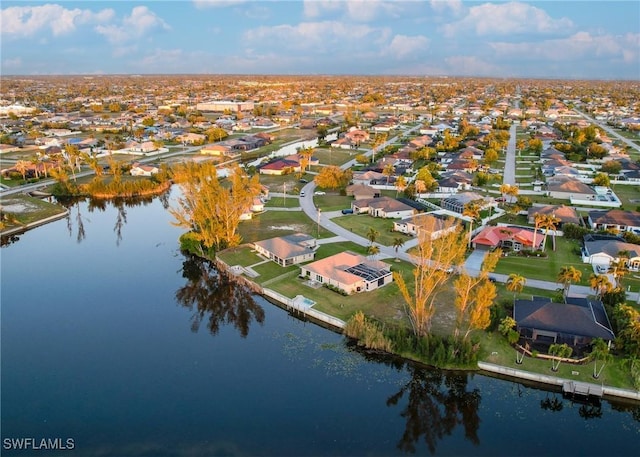 2902 SW 10th Pl, Cape Coral, FL 33914 - aerial view of property and surrounding area with a large body of water and nearby suburban area