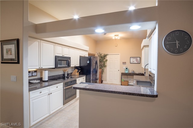 kitchen featuring kitchen peninsula, white cabinetry, light tile patterned floors, and black appliances