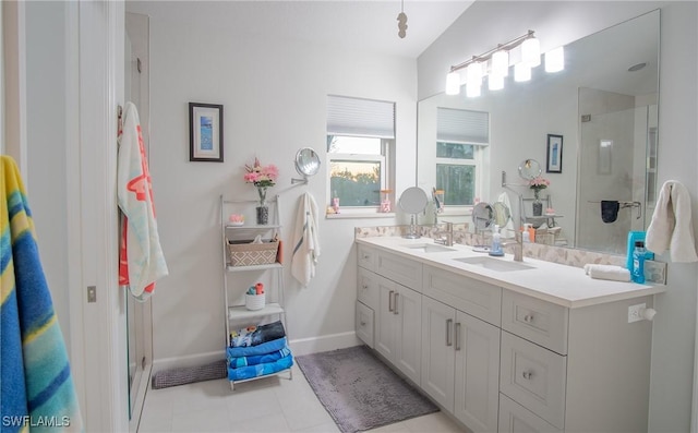 2902 SW 10th Pl, Cape Coral, FL 33914 - bathroom with double vanity, a stall shower, and baseboards