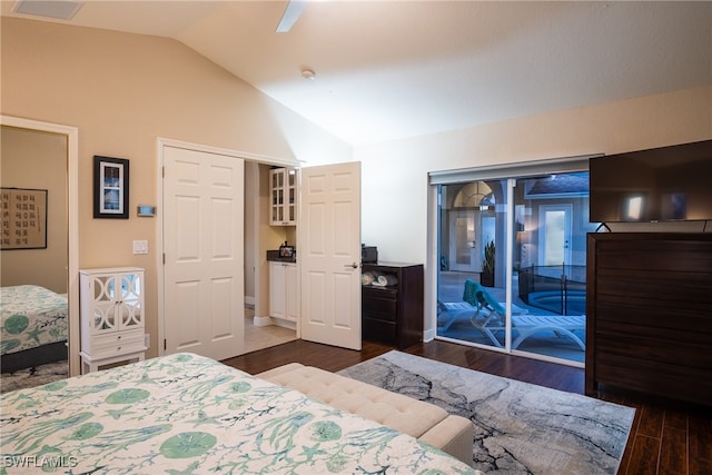 bedroom with vaulted ceiling, access to exterior, ceiling fan, and dark hardwood / wood-style floors