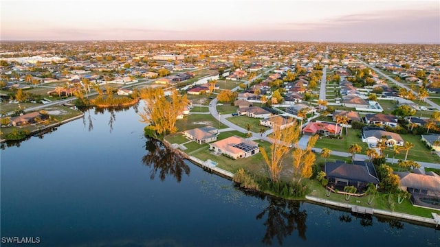 2902 SW 10th Pl, Cape Coral, FL 33914 - aerial view at dusk of a water view and a residential view