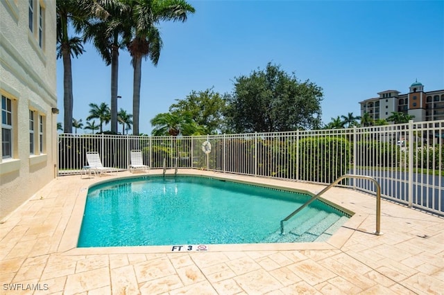 view of pool featuring a patio