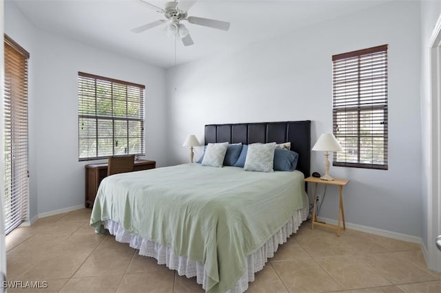 tiled bedroom with ceiling fan