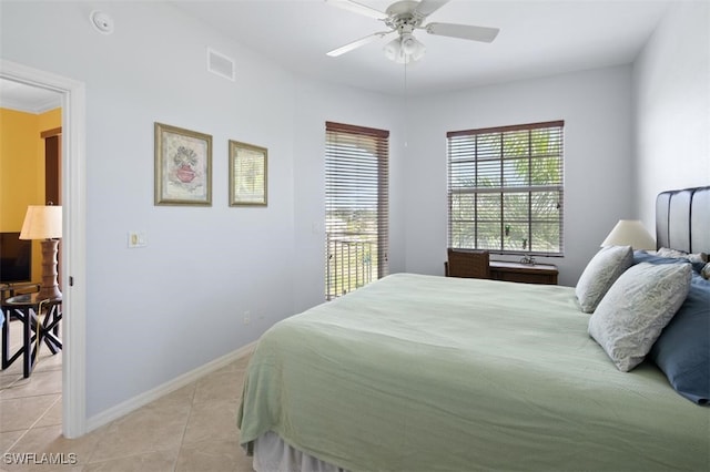 bedroom featuring ceiling fan, light tile patterned flooring, and crown molding