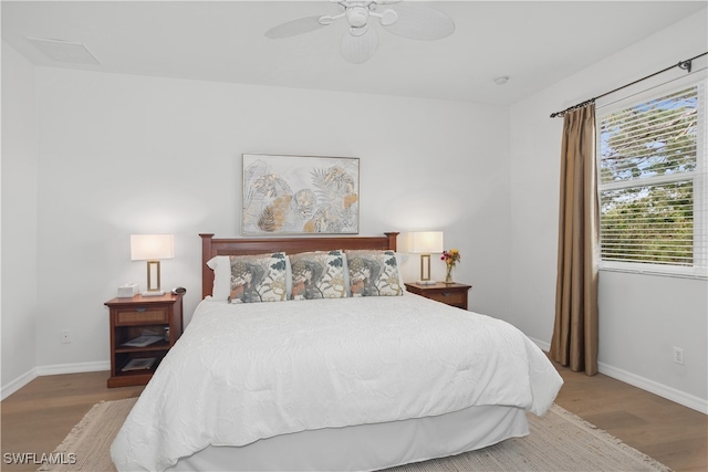 bedroom featuring ceiling fan and hardwood / wood-style flooring