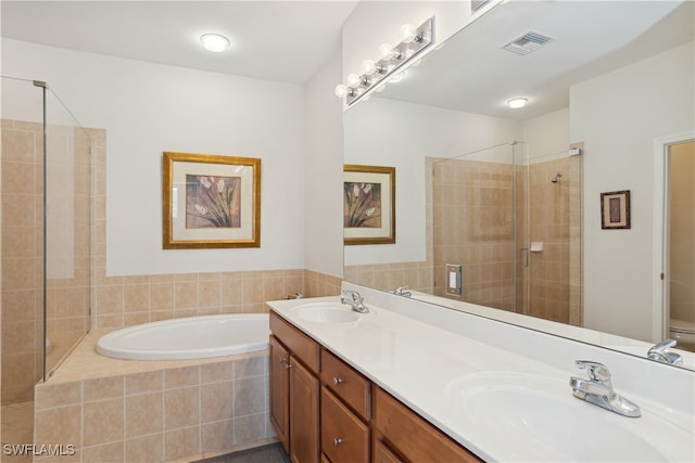 full bathroom with vanity, separate shower and tub, and toilet