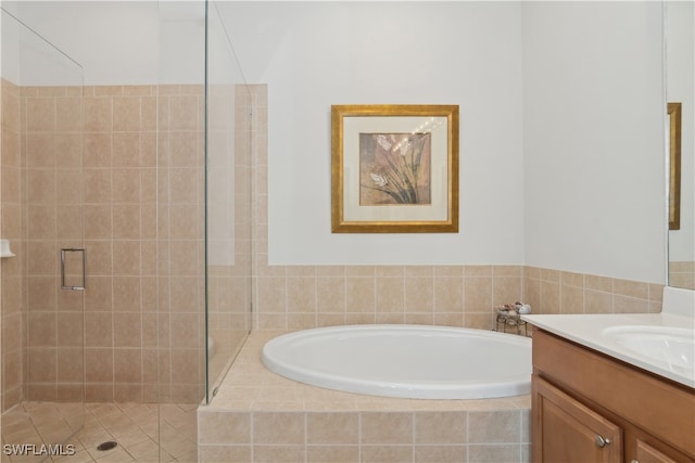 bathroom featuring vanity and plus walk in shower