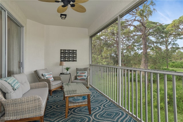 sunroom featuring ceiling fan