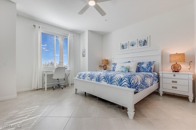 tiled bedroom with ceiling fan