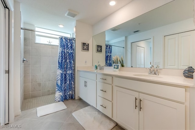 bathroom featuring tile patterned floors, vanity, and a shower with shower curtain