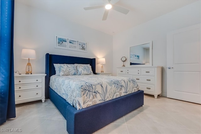 tiled bedroom with ceiling fan