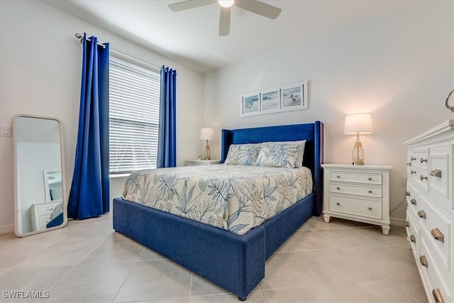 bedroom featuring ceiling fan and light tile patterned flooring