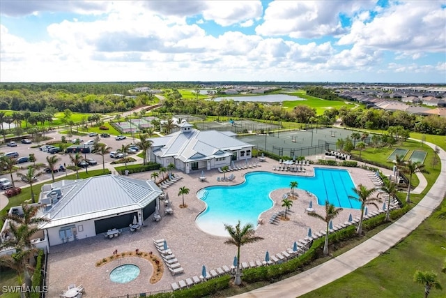 view of pool featuring a water view