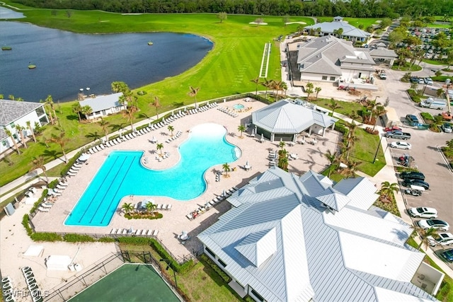 birds eye view of property with a water view