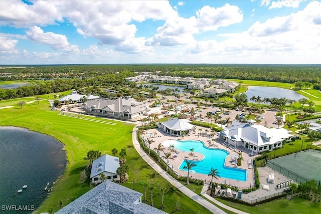 birds eye view of property with a water view