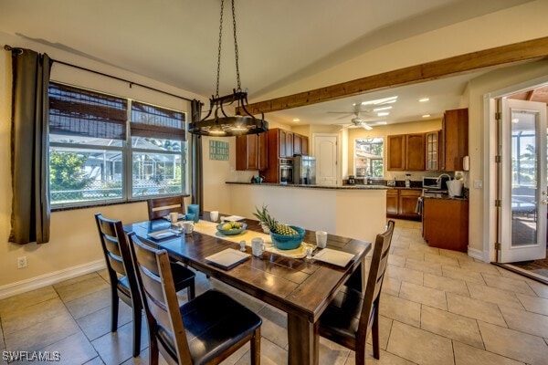 tiled dining room featuring ceiling fan