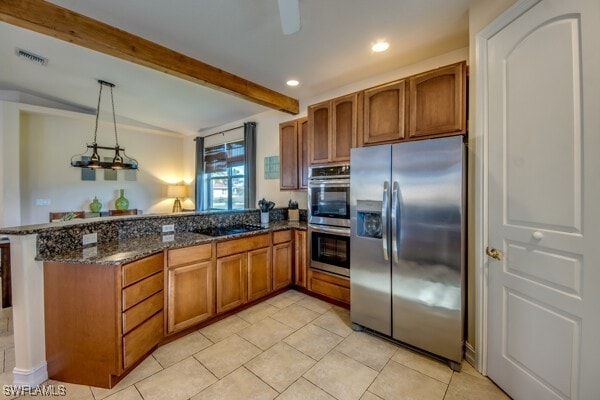 kitchen with pendant lighting, dark stone counters, beam ceiling, kitchen peninsula, and stainless steel appliances