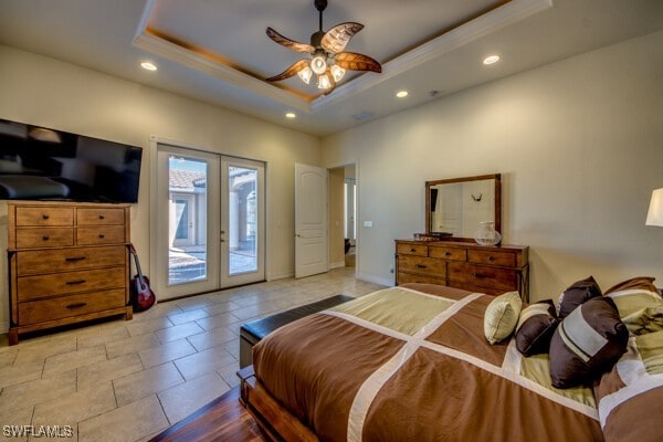 bedroom featuring ceiling fan, french doors, a raised ceiling, crown molding, and access to outside