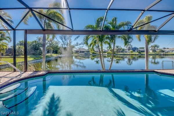 view of swimming pool with a water view