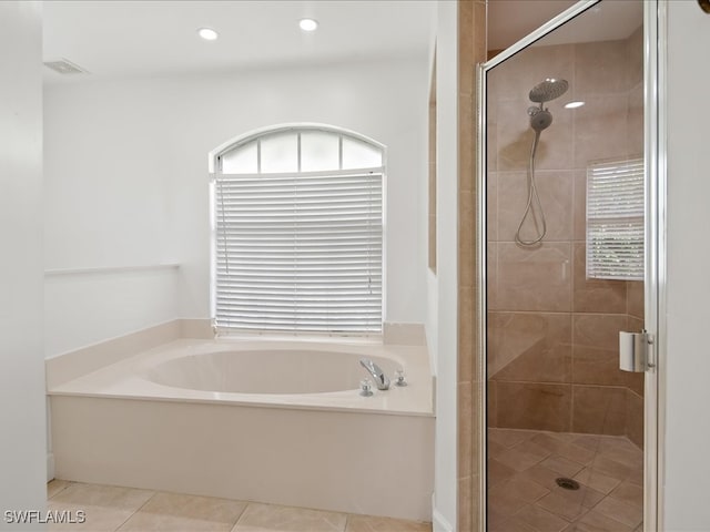 bathroom with tile patterned floors and separate shower and tub