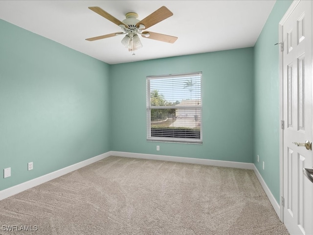 spare room with carpet flooring and ceiling fan