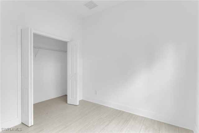 unfurnished bedroom with a closet