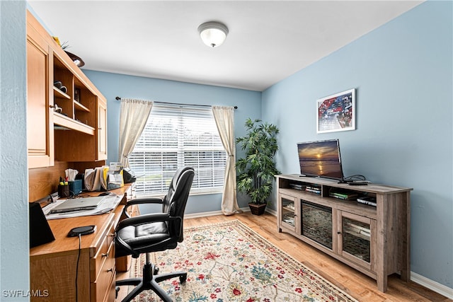 office space with light wood-type flooring