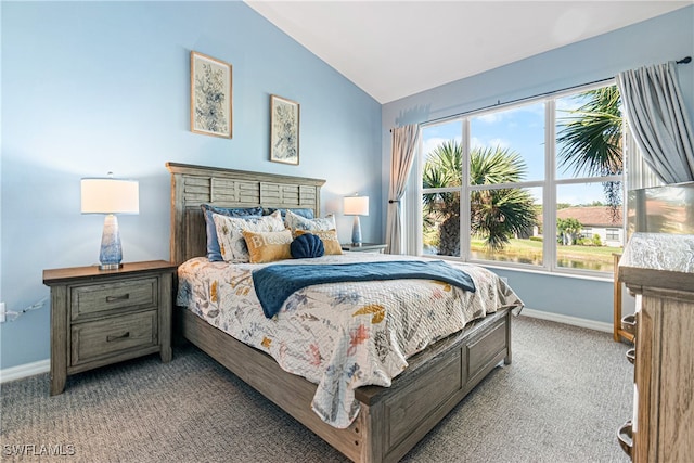 carpeted bedroom featuring lofted ceiling