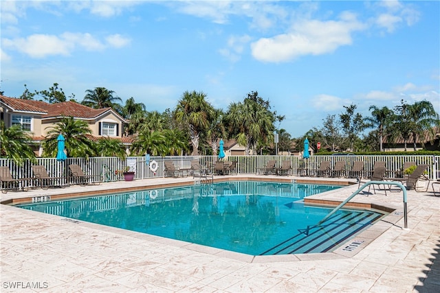 view of swimming pool with a patio