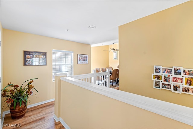 corridor with light hardwood / wood-style flooring