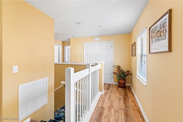 hall with light hardwood / wood-style flooring