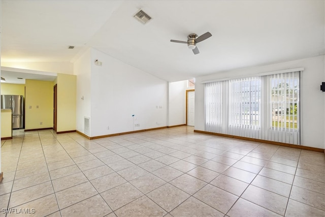 tiled spare room with ceiling fan and lofted ceiling