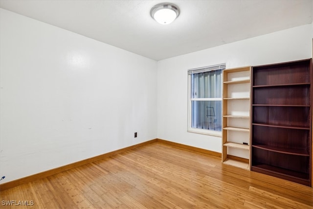 unfurnished room featuring hardwood / wood-style floors