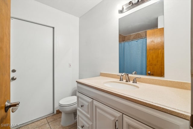 bathroom featuring tile patterned flooring, vanity, toilet, and a shower with shower curtain