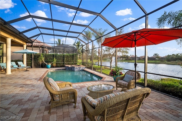 view of swimming pool featuring glass enclosure, a patio area, and a water view