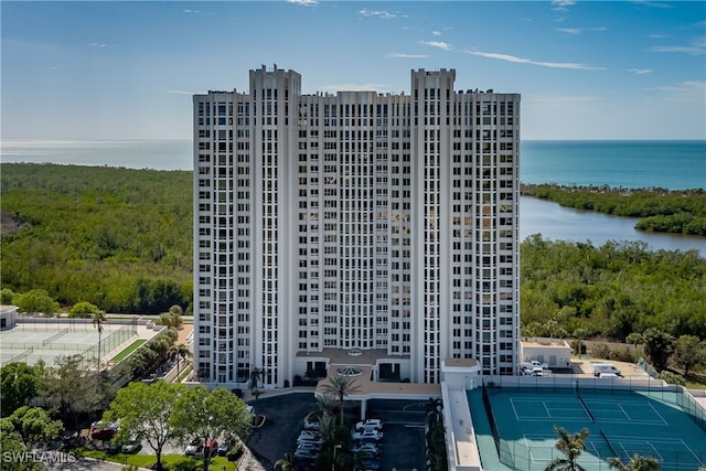 view of building exterior with a water view