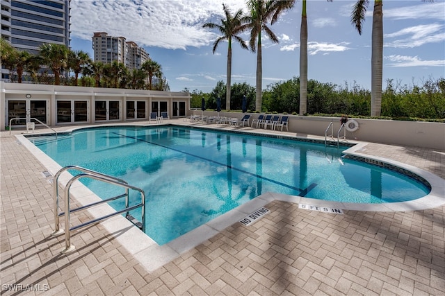 view of swimming pool featuring a patio area